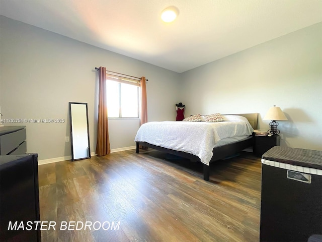 bedroom featuring dark wood-type flooring