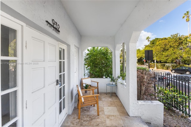 balcony featuring a porch