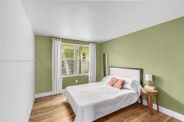 bedroom featuring light hardwood / wood-style floors