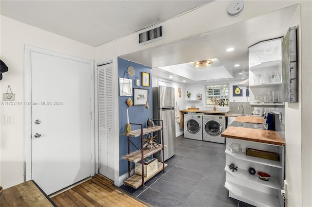 laundry room with sink and washer and dryer