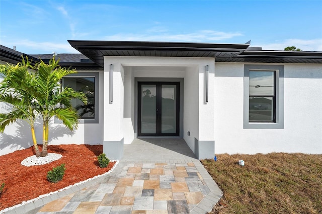 doorway to property featuring a patio area and french doors