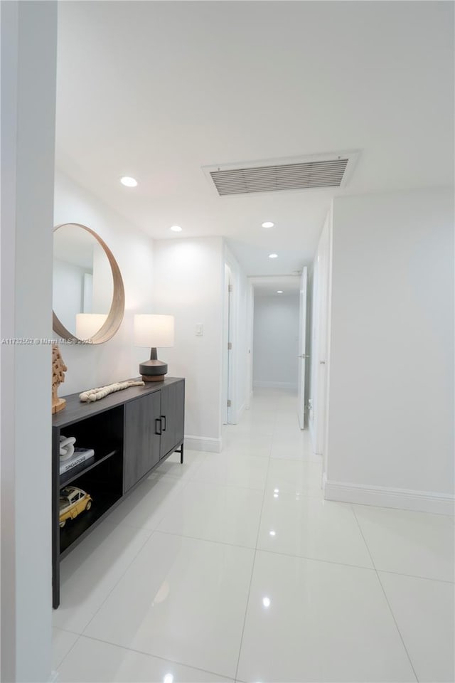 corridor with light tile patterned floors