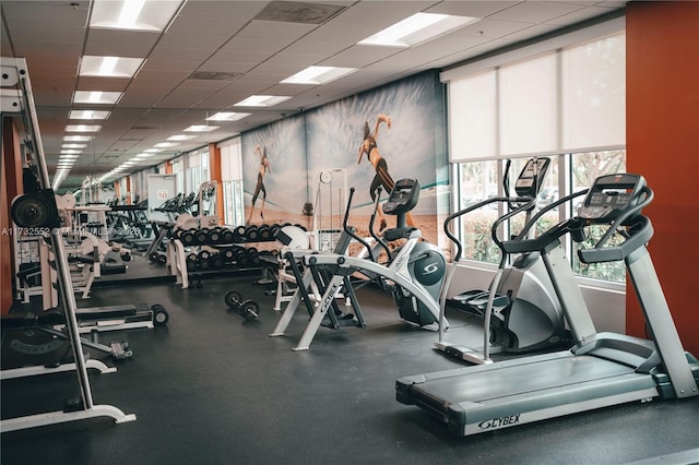 exercise room with a paneled ceiling