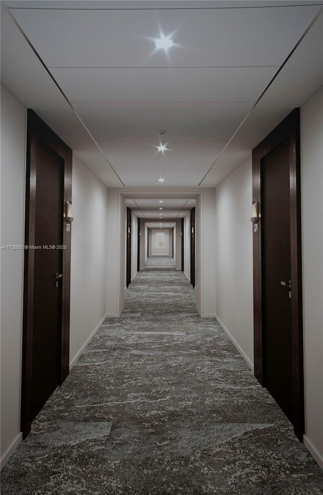 hall with carpet flooring