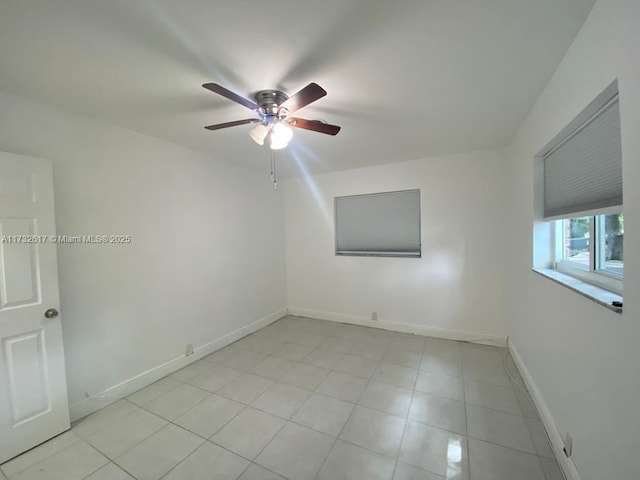 spare room with ceiling fan