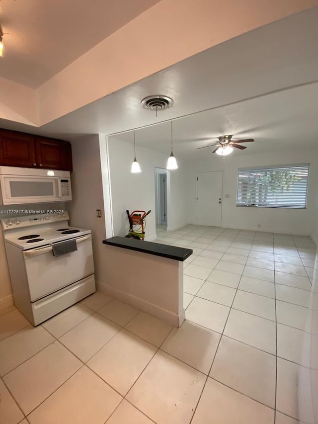 kitchen featuring ceiling fan, white appliances, hanging light fixtures, and light tile patterned floors