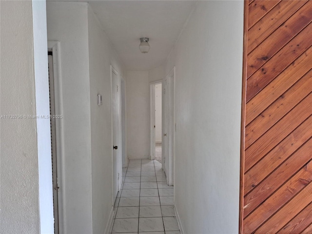 hallway featuring light tile patterned floors