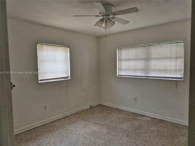 unfurnished room with ceiling fan