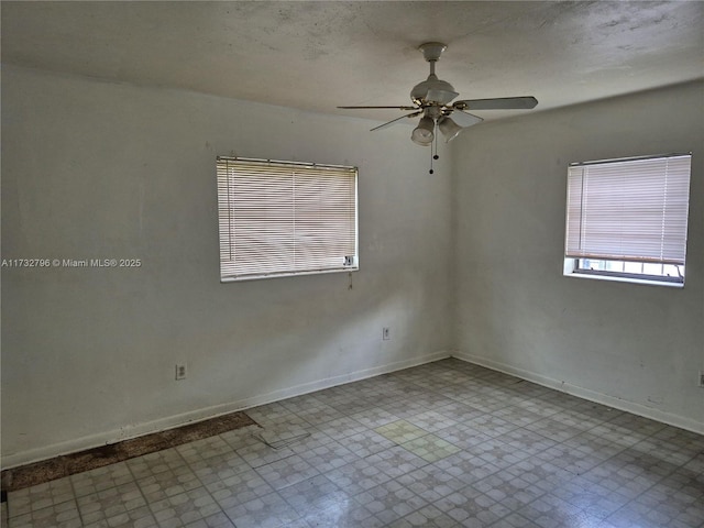 unfurnished room featuring ceiling fan