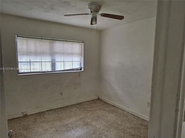 unfurnished room with ceiling fan