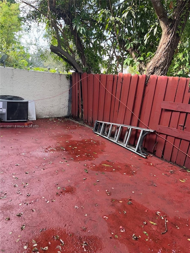 view of yard with a patio and central air condition unit