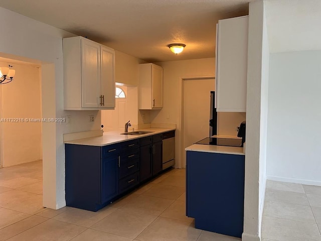 kitchen featuring light tile patterned flooring, blue cabinets, sink, white cabinets, and stainless steel dishwasher