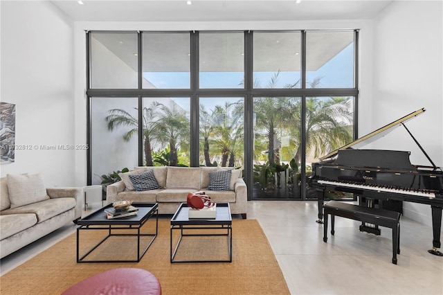 living room featuring floor to ceiling windows