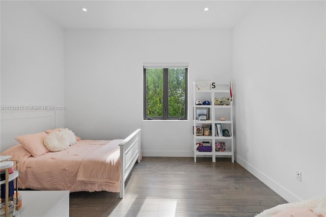 bedroom featuring dark wood-type flooring