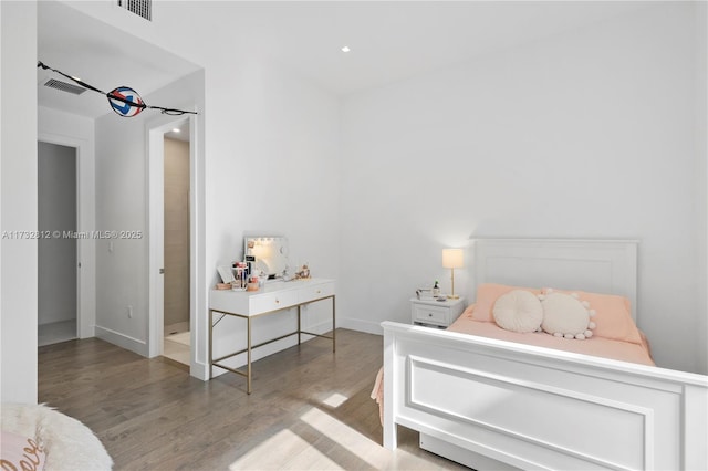 bedroom with wood-type flooring