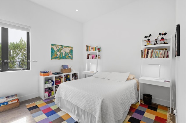 bedroom with hardwood / wood-style floors