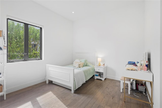 bedroom with hardwood / wood-style flooring