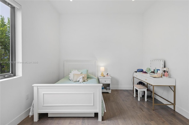 bedroom featuring dark hardwood / wood-style floors