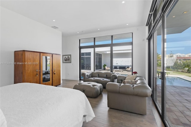 bedroom featuring dark hardwood / wood-style floors and access to exterior