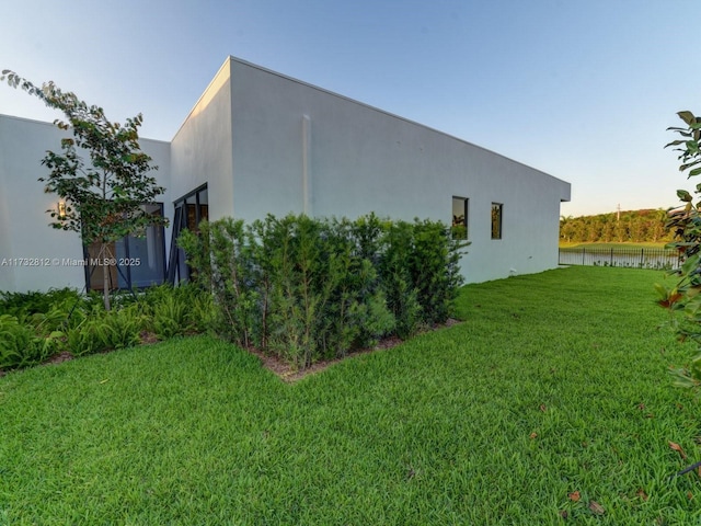 view of home's exterior featuring a yard