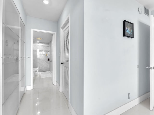 hallway with light tile patterned flooring