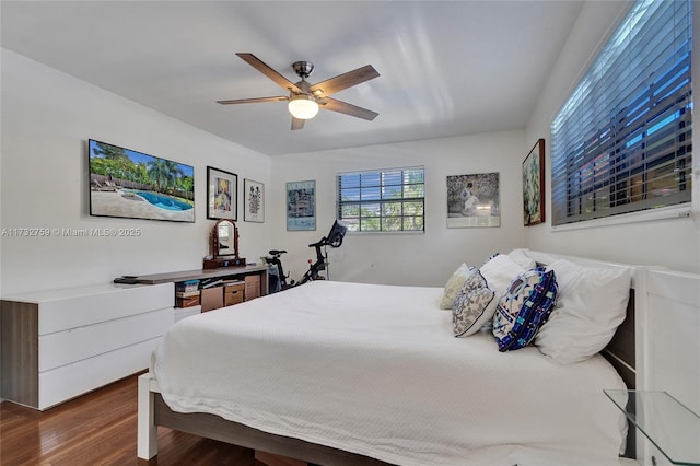 bedroom featuring dark wood-type flooring and ceiling fan