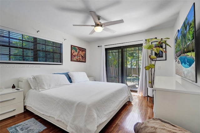 bedroom with dark hardwood / wood-style flooring, access to outside, and ceiling fan