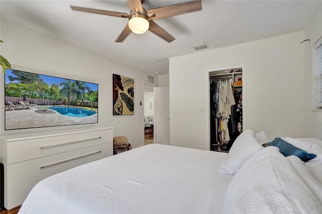 bedroom with ceiling fan and a closet