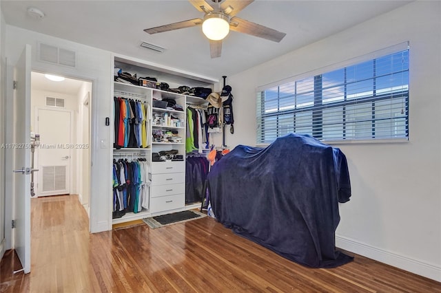 spacious closet featuring wood-type flooring and ceiling fan