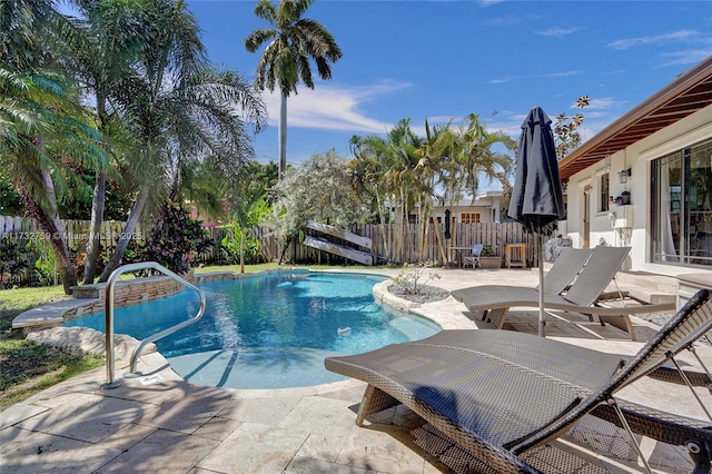 view of swimming pool with a patio