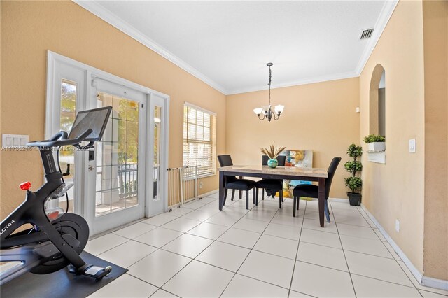 unfurnished room featuring light tile patterned floors and ornamental molding