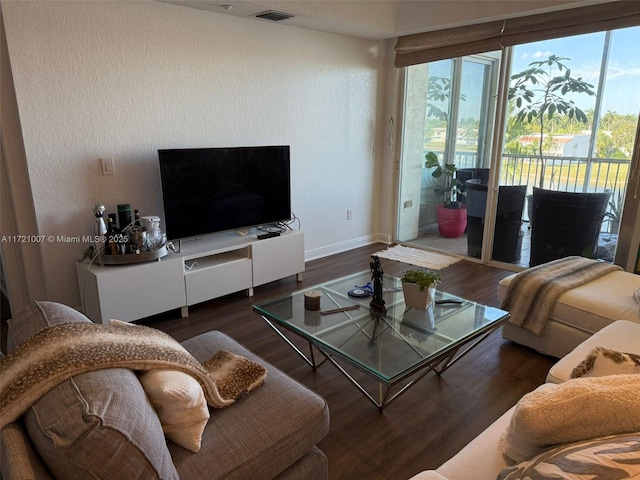 living room with dark hardwood / wood-style flooring