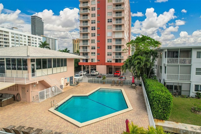 view of swimming pool with a patio area