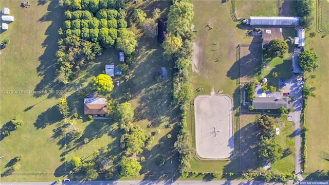 birds eye view of property with a rural view