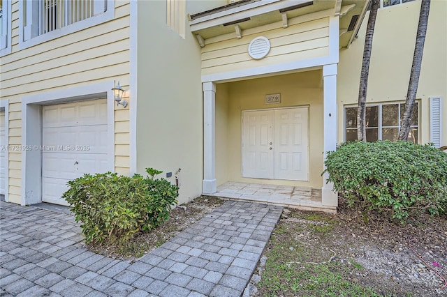 doorway to property featuring a garage