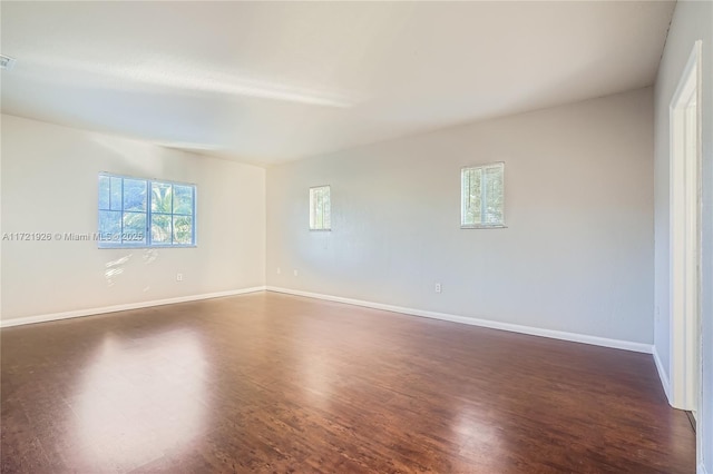 empty room featuring dark hardwood / wood-style floors