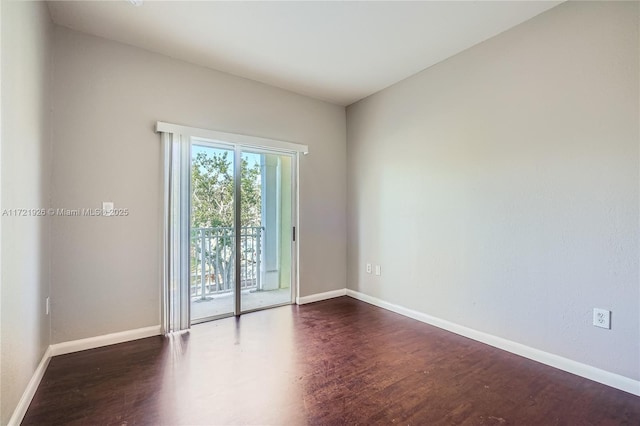 unfurnished room with dark hardwood / wood-style floors