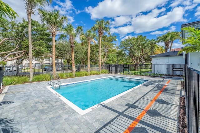 view of swimming pool featuring a patio area