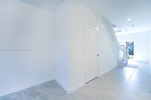 corridor featuring light tile patterned flooring