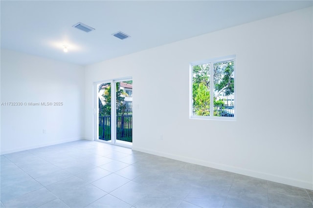 view of tiled spare room