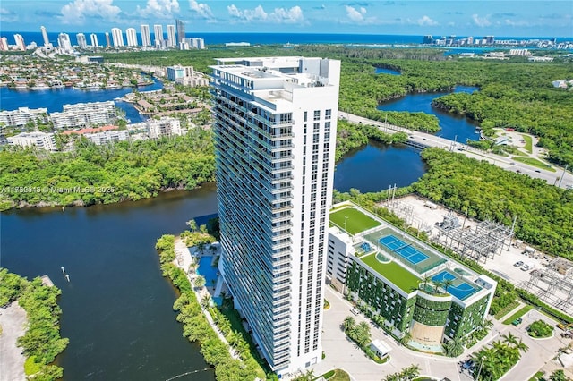 drone / aerial view featuring a water view and a city view