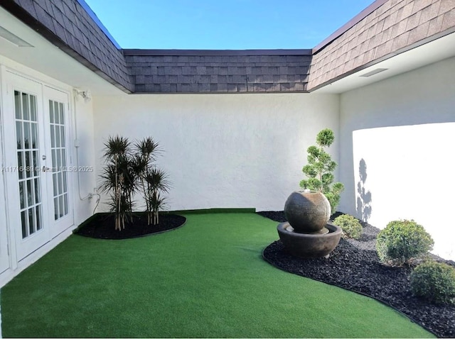 view of yard with french doors