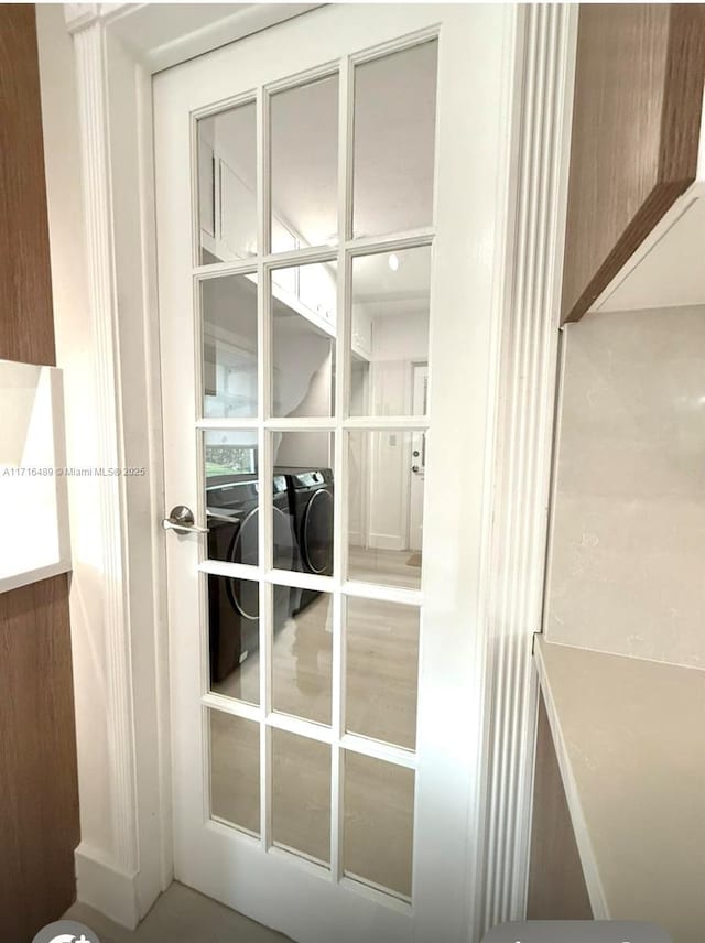 interior space featuring french doors and washer and clothes dryer