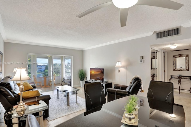 living room featuring ornamental molding and a textured ceiling