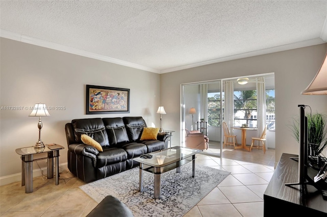 tiled living room with ornamental molding and a textured ceiling