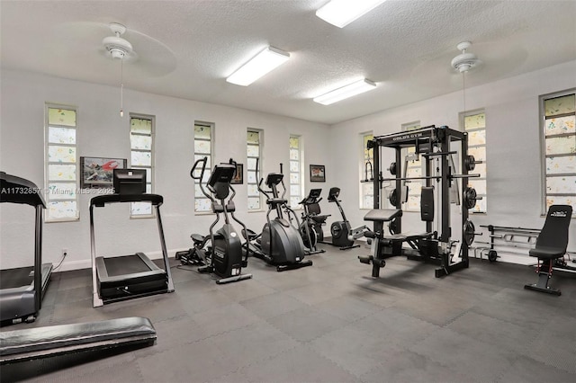 gym featuring a textured ceiling