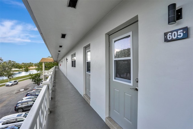 balcony featuring a water view