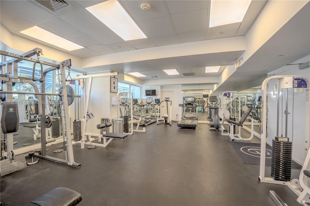 gym featuring a drop ceiling