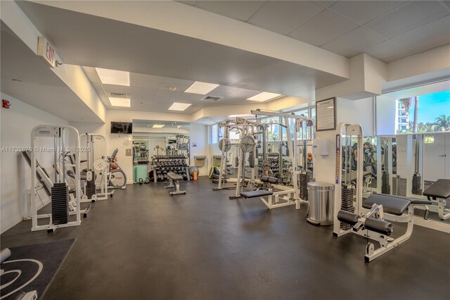 workout area with a paneled ceiling