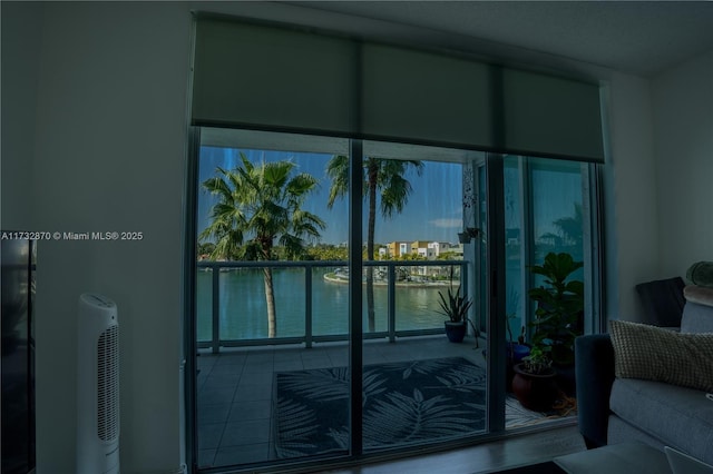 doorway to outside with a water view